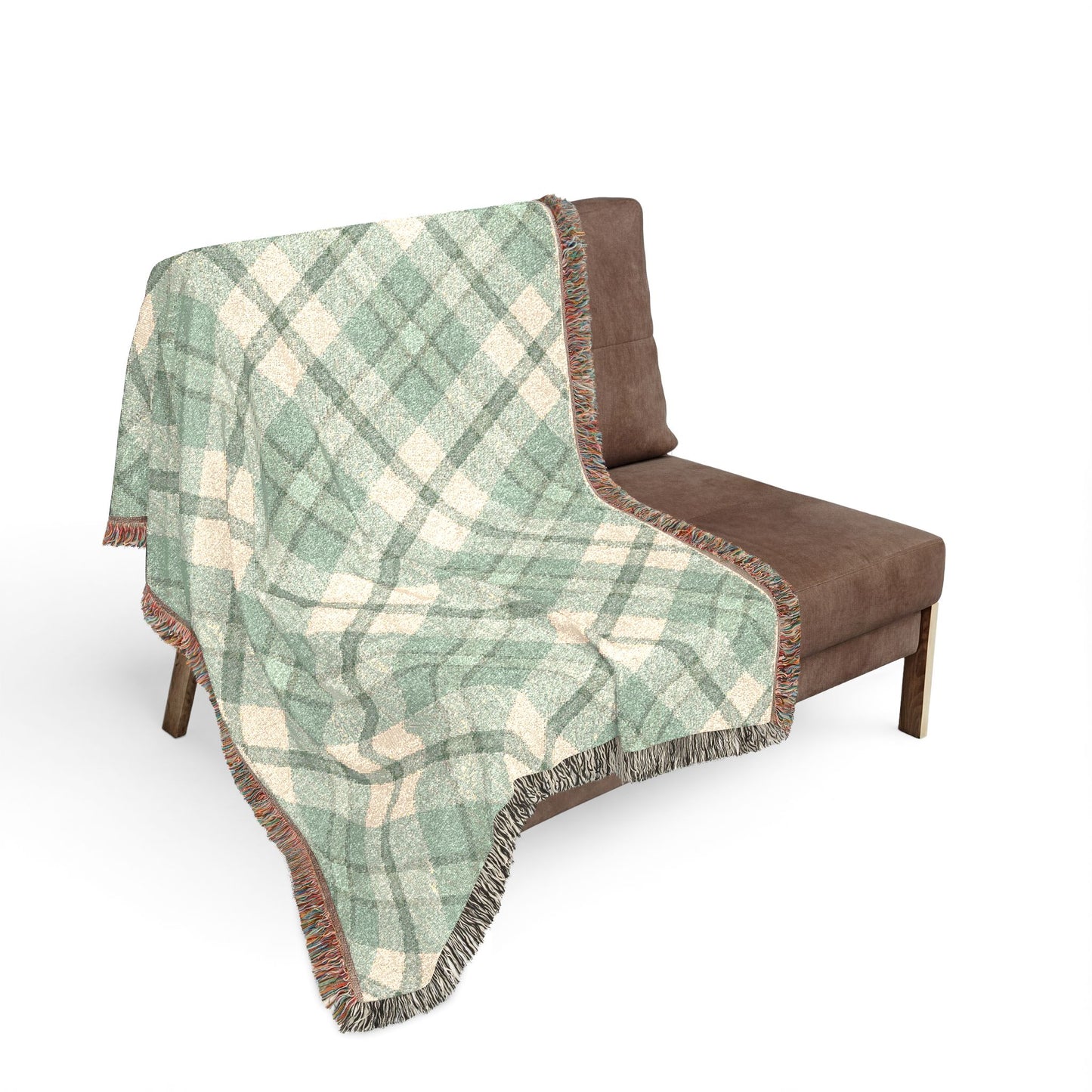 Plaid blanket draped over a brown chair on a white background
